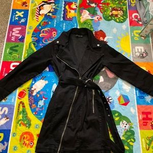 A black long sleeve jacket dress.